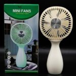 Beige vase-style mini USB rechargeable fan standing next to its green packaging box.